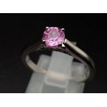 A stunning natural 0.64 carat pink sapphire from Ceylon which is unheated and untreated with