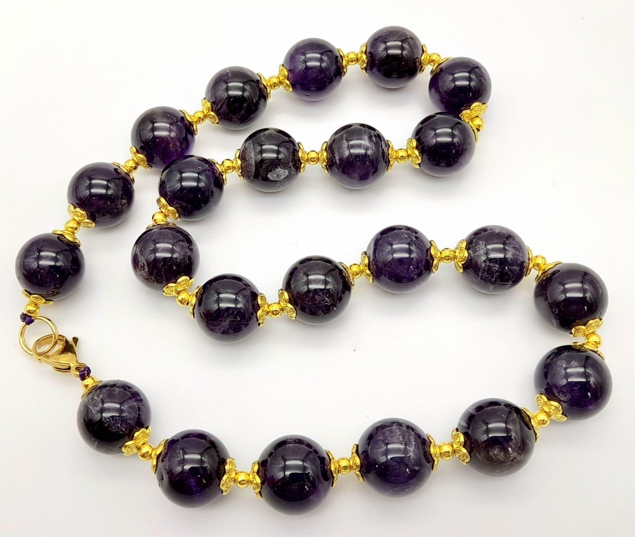 A Purple Stone, Possibly Amethyst Beaded Necklace. Gilded spacers and clasp. 42cm - Image 2 of 3