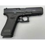 A Deactivated 9mm Glock Model 17 Generation 5 Semi-Automatic Pistol. Comes with extra grip sets