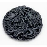 A Black Jade Circular Dragon Pendant. 4.5cm diameter.