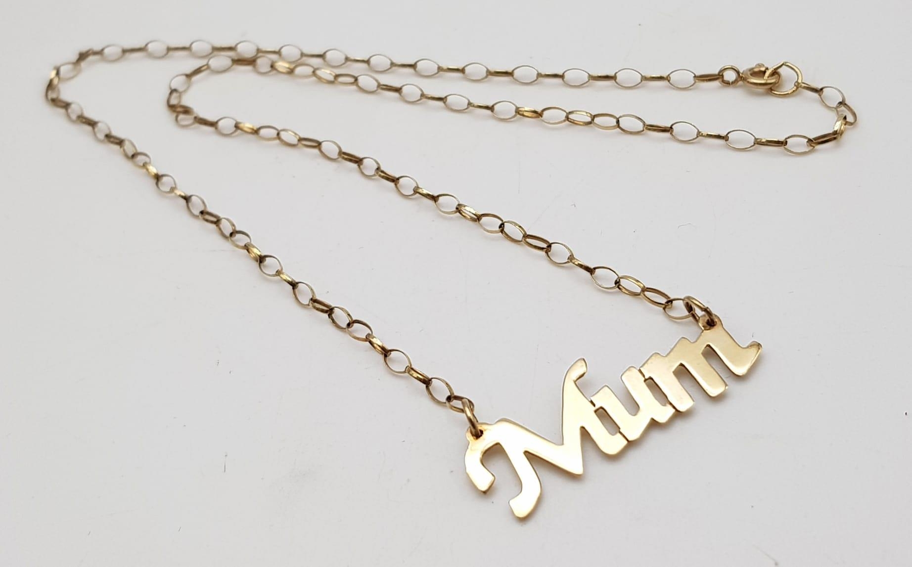 A 9 K yellow gold MUM pendant on chain. Length: 43 cm, weight: 3.4 g.