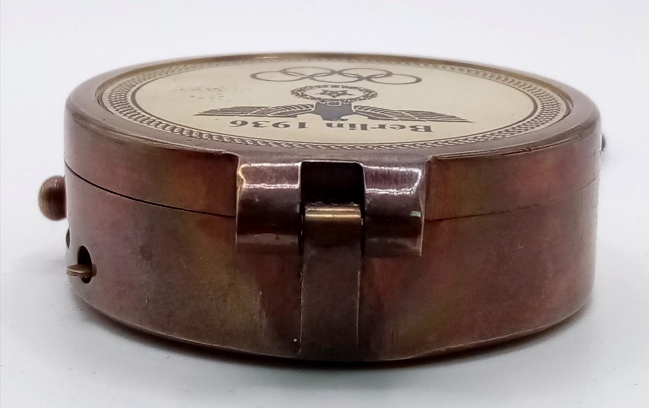 A brass compass with immobiliser, brass chain and inscription BERLIN 1936 in a wooden box with - Image 4 of 6