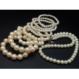 A faux pearl necklace (length: 39-48 mm) AND eight expandable faux pearl bracelets.