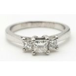 An 18K White Gold Diamond Ring. Three diamonds - 0.49ct with diamond grading certificate. Size L.