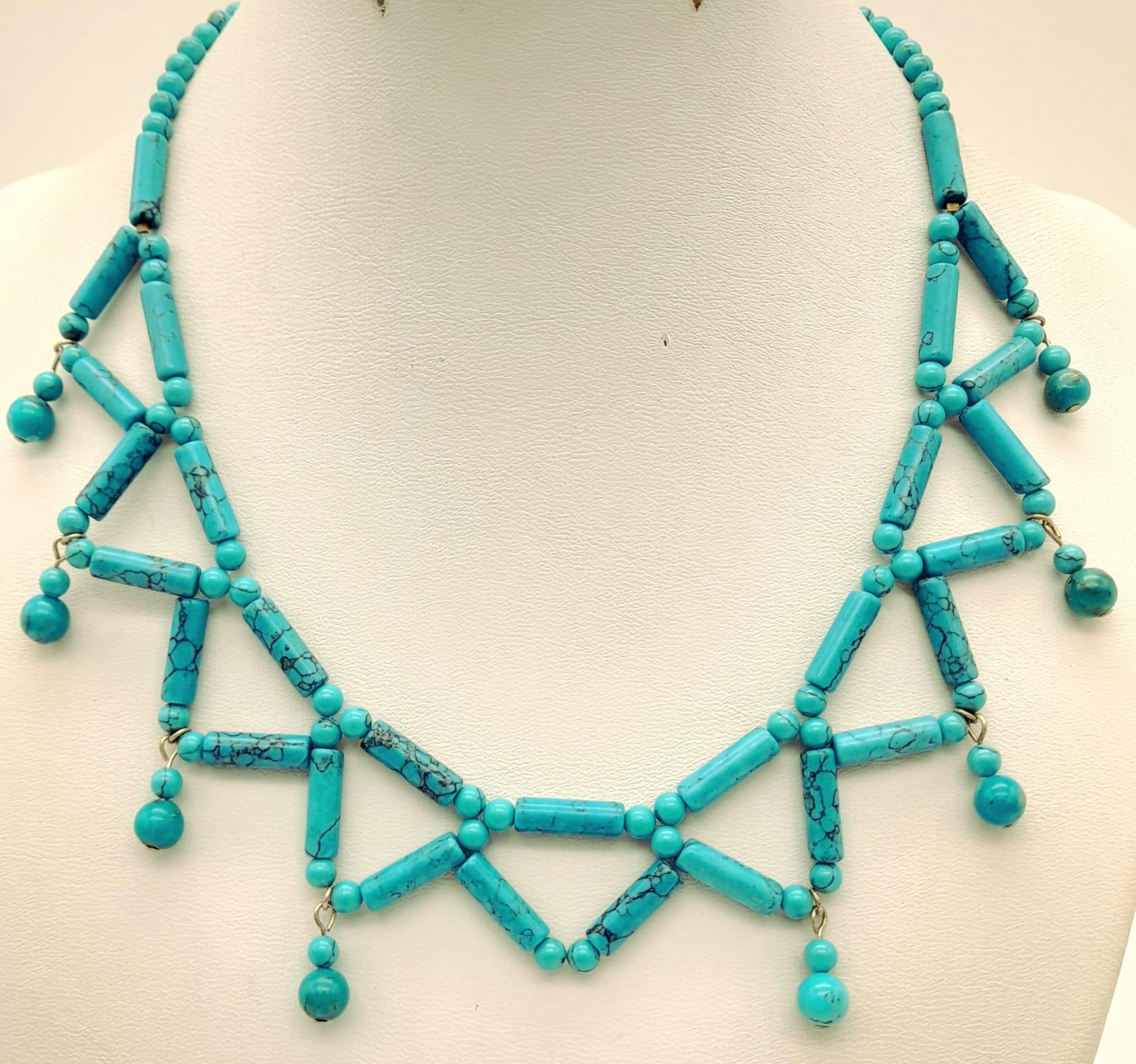 A Turquoise Tube Bead Choker Necklace. 36cm