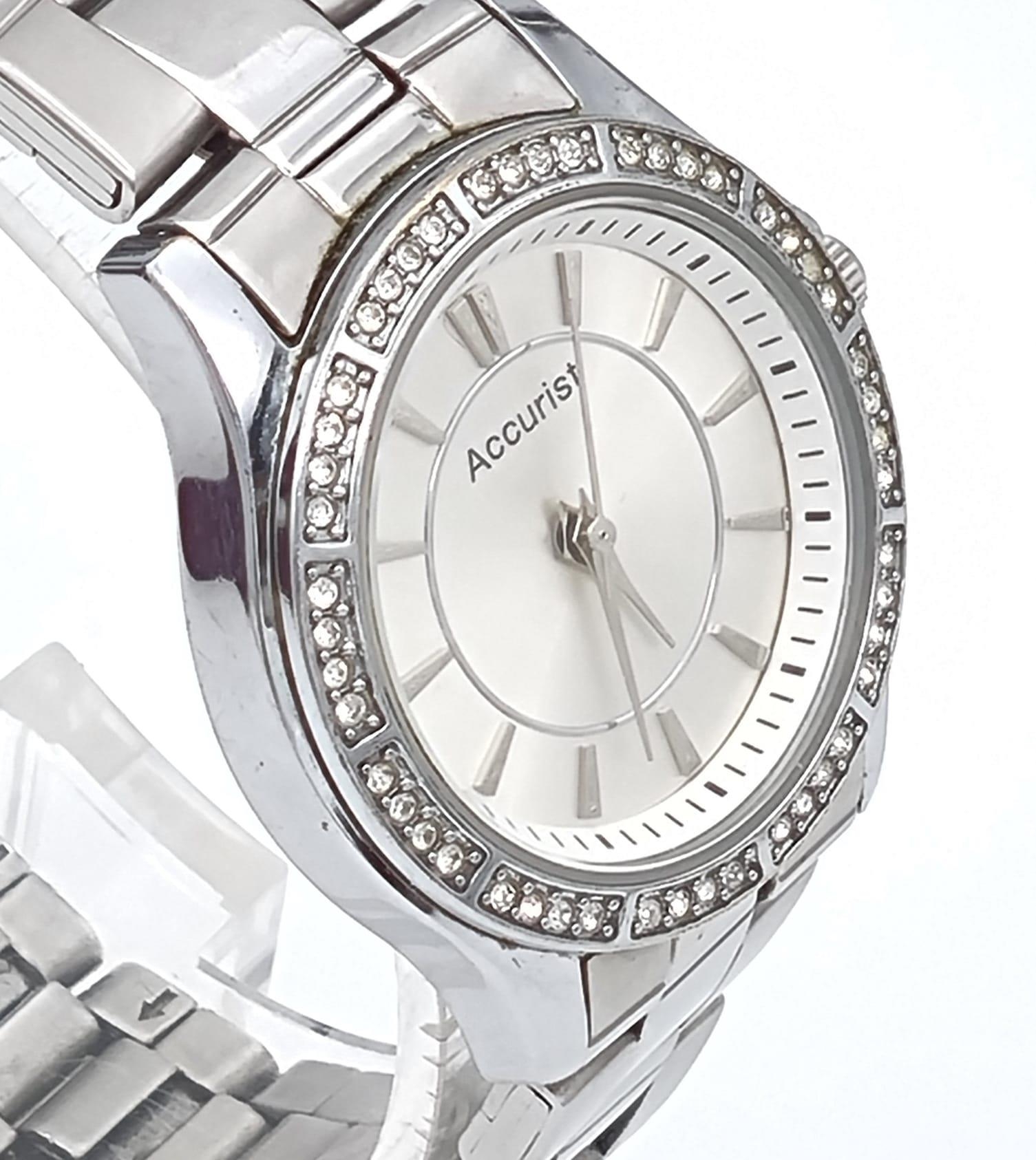 A Quality Accurist Ladies Diamonte Watch. Stainless steel strap and case - 28mm. Silver tone dial. - Image 2 of 10