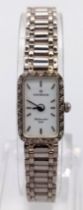 A Sovereign 9K White Gold Ladies Watch. 9K gold strap and case - 12 x 20mm. Diamond bezel. Quartz