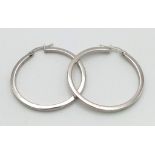 A 9 K white gold pair of hoop earrings . Diameter: 34 mm, weight: 1.8 g.