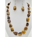 A totally natural, TIGER’S EYE necklace and earrings set with large cabochons. Necklace length: 52