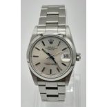THE MID SIZE ROLEX OYSTER PERPETUAL DATEJUST IN STAINLESS STEEL , WITH SILVER TONE FACE, VERY GOOD