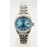 A LADIES OYSTER PERPETUAL DATEJUST IN STAINLESS STEEL WITH DIAMOND NUMERALS AND UNUSUAL TURQUOISE