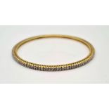 A 18K GOLD AND DIAMOND SLAVE BANGLE, 12.7gms 7cms diameter