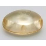 A 11.30ct Citrine Quartz. Oval cabochon. Comes with a certificate.