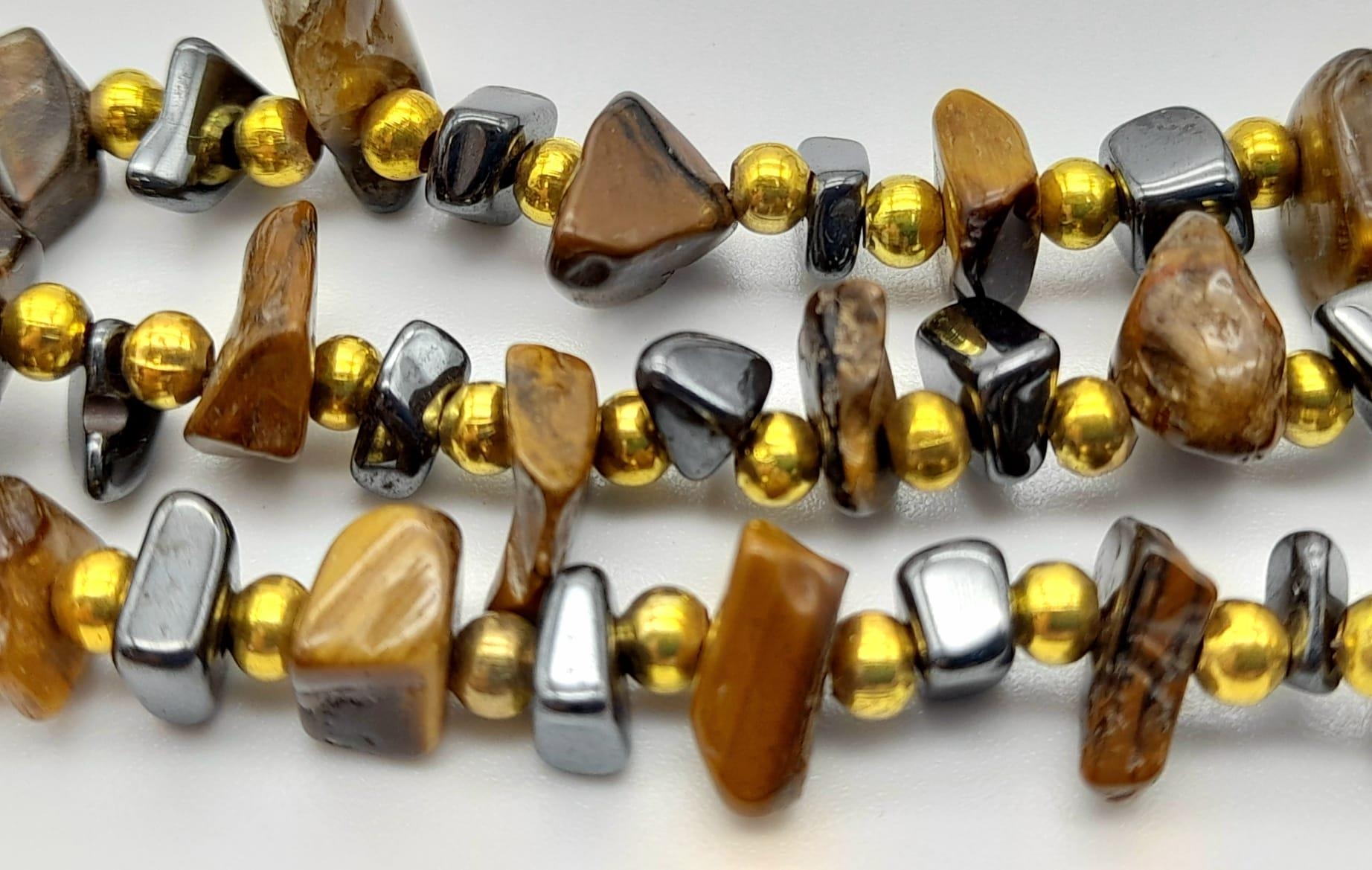 A Three Strand Rough Tigers Eye Bead Necklace. 60cm. - Image 3 of 4