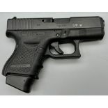A Deactivated 9mm Glock Model 26 Generation 4 Semi-Automatic Pistol. Comes with two extended