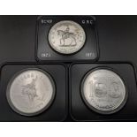 Three Uncirculated Canadian Silver Dollars in Original Presentation Cases.