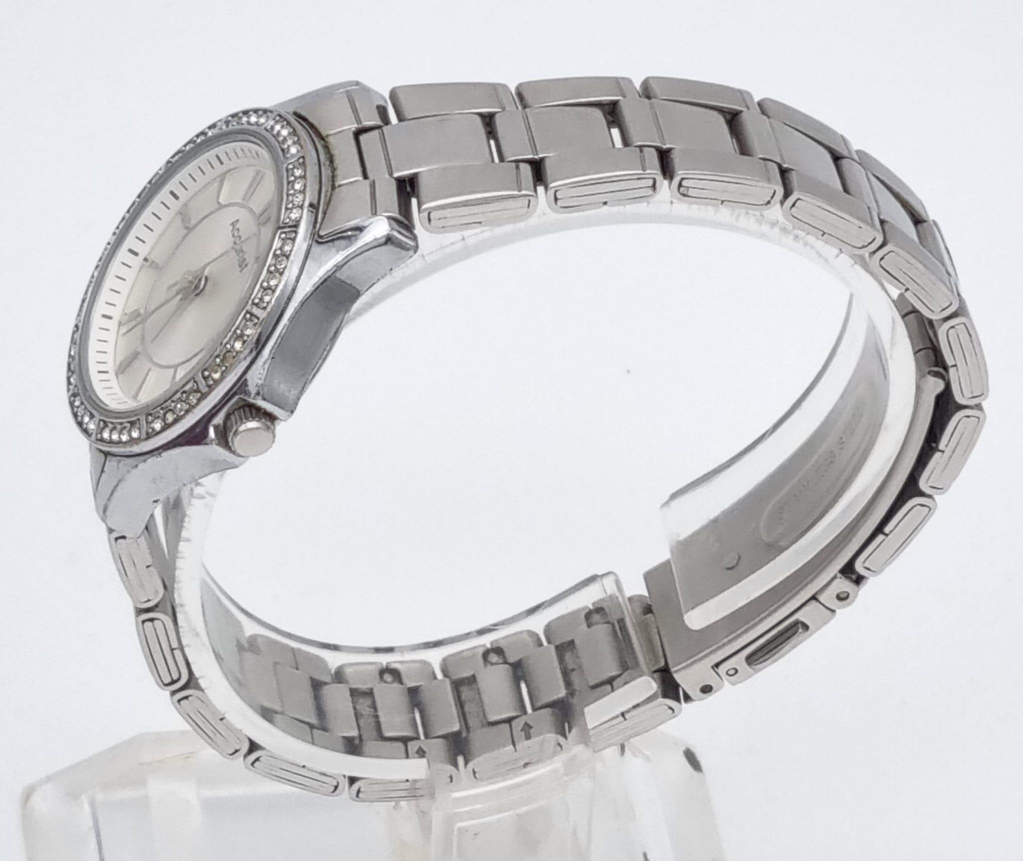 A Quality Accurist Ladies Diamonte Watch. Stainless steel strap and case - 28mm. Silver tone dial. - Image 4 of 10