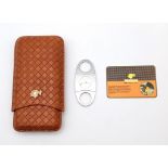 A COHIBA leather cigar case with cutter and velvet travel pouch. Adjustable length, in new/unused