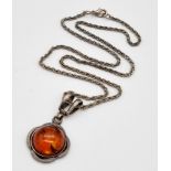 A Vintage Amber Cabochon set in a 925 Silver Pendant -on a vintage necklace. 2 and 46cm.