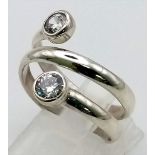 A sterling silver two stone wrap ring. Size: P, weight: 4.3 g.