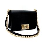 A black textured leather Furla Mimì mini crossbody bag, adjustable shoulder strap in leather with ch