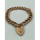 Vintage 9 carat GOLD LINK BRACELET with gold padlock fastening.Having padlock and each link marked