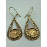 9 carat pair of GOLD EARRINGS fitted with GOLD PESOS and having filigree detail to sides. 2.99 gram