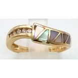 A 14K Yellow Gold Mother of Pearl and Diamond Ring. Six sections of MOP and five diamonds, what a co