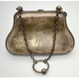AN ANTIQUE SILVER HANDBAG DATED 1905 WITH ORIGINALGREEN LINING. (NEEDS A GOOD CLEAN) 147gms