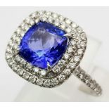 A Tiffany and Co 950 Platinum Tanzanite and Diamond Soleste Ring. An exquisite cushion-cut 2.0ct (ap