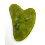 An Irregular Shaped Slice of Green Jade. 7 x 5cm. 5mm thick.