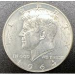 A 1964 KENNEDY SILVER HALF DOLLAR COIN . 12.5gms