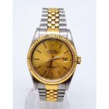 A Rolex Oyster Perpetual Datejust Gents Watch. Steel and gold strap and case - 36mm. Gold tone dial