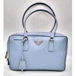A Prada Pale Blue Leather Mini Tote Bag. Prada log on exterior. Monogram cloth interior with zip poc