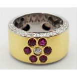 AN 18K 2 COLOUR GOLD DIAMOND AND RUBY HAND CRAFTED RING .14gms 0.70ct size N