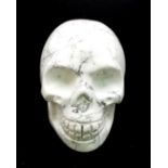 A Hand-Carved White Howlite Quartz Skull Figure. 5 x 4.5cm