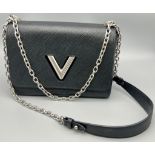 A Very Stylish Louis Vuitton Black Epi Twist Crossbody Bag. Silver tone hardware. 24 x 17cm. Comes