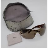 A Pair of Christian Dior Ladies Sunglasses With Tortoise shell Effect Handles. The glasses are in ve