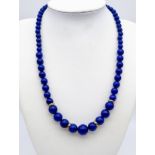 A Lapis Lazuli Graduated Collarette Necklace with a 9K Yellow Gold Clasp and Spacer Beads. 41.54g to