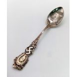 AN ANTIQUE SILVER DECORATIVE TEASPOON MADE IN BRAZIL AND USING THE SWASTIKA WHEN IT DENOTED PEACE