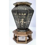An antique, seven sided, engraved and embossed brass vase from Middle East. With custom made base.