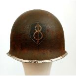 A WW2 USA 8th Infantry Division M1 Swivel Bale Helmet with Westing-House Liner.