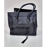 A Celine of Paris Black Leather Tote Bag. Rich black leather exterior with a zipped compartment.