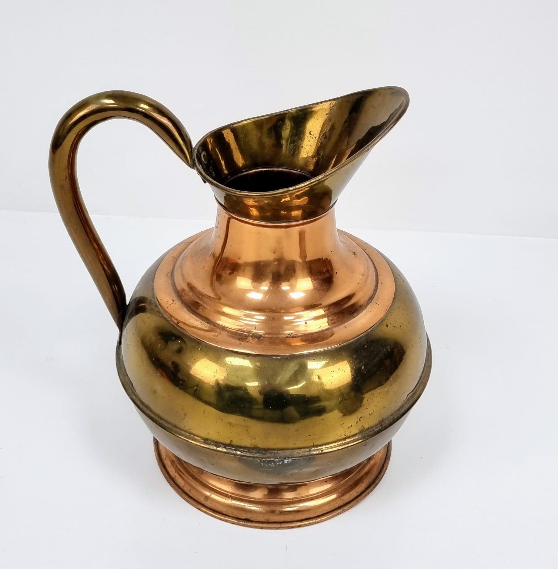 A pair of Copper and Brass jugs. One large and one small. Measurements: Large one, 315×250mm. - Image 2 of 9