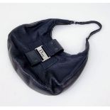 A Christian Dior Street-Chic Hobo Bag in Black Grained Leather. Silver-toned hardware. Dior monogram