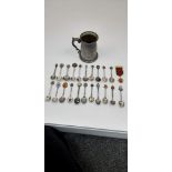 An interesting lot of over 20 collectable silver plated spoons AND an English pewter jug with a