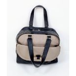 A Jimmy Choo Two-Tone Leather Square Tote Bag. Beige and black leather with gilded hardware. Cloth