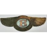 A Very Rare 1923 Bentley 3 Litre Car Badge. Brass with green enamel. The very first winged B design.