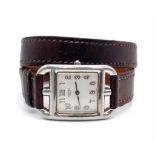 A Hermes of Paris Ladies Quartz Watch. Long double-twist leather strap - 35cm. Belt buckle case - 23