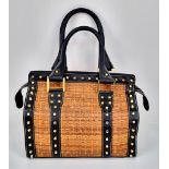 A Wonderful Fendi Rattan Bag. Interwoven straw and leather exterior. Gilded studs throughout.